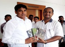Ranjan Pradhan presenting his books to former Panchayatiraj Minister Dr. Arun Sahu